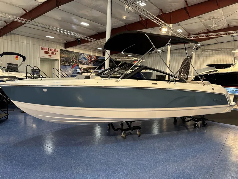 Slide: The Image of 2025 Cobalt CS22 boat displayed indoors on a showroom floor. - 1