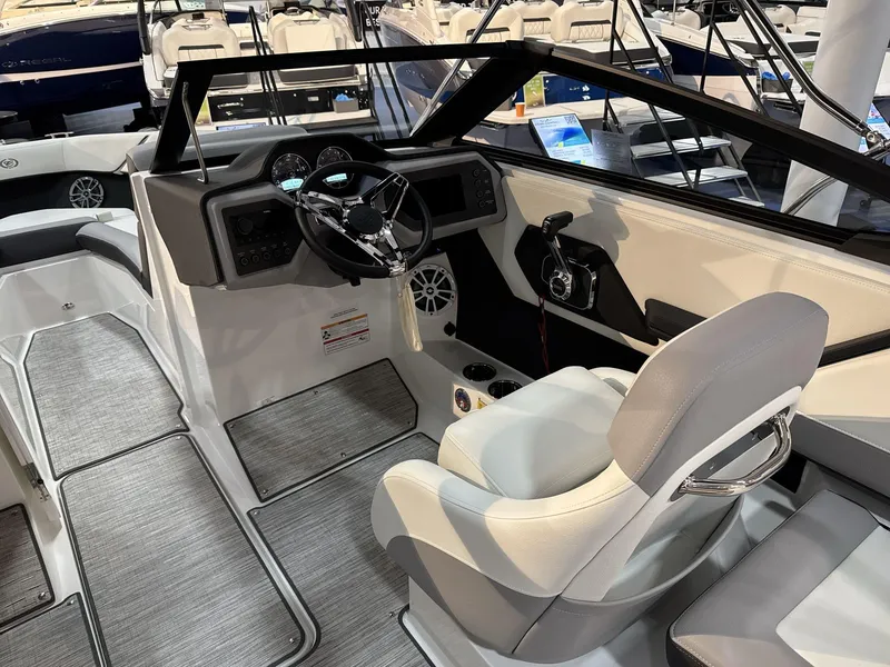 Slide: The Image of 2025 Cobalt CS22 boat interior with modern dashboard and steering wheel. - 10
