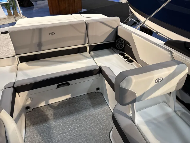 Slide: The Image of 2025 Cobalt CS22 boat interior with gray seating and cup holders. - 14