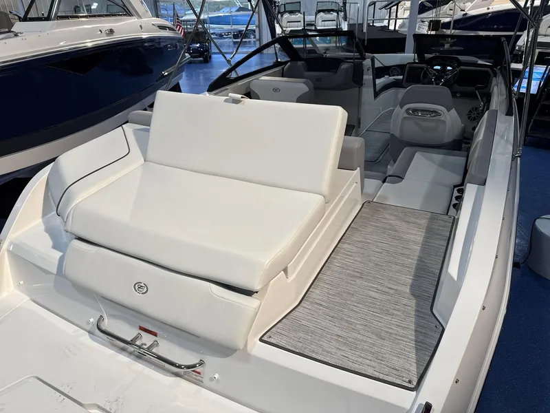 Slide: The Image of 2025 Cobalt CS22 boat interior with white seating and modern dashboard. - 17