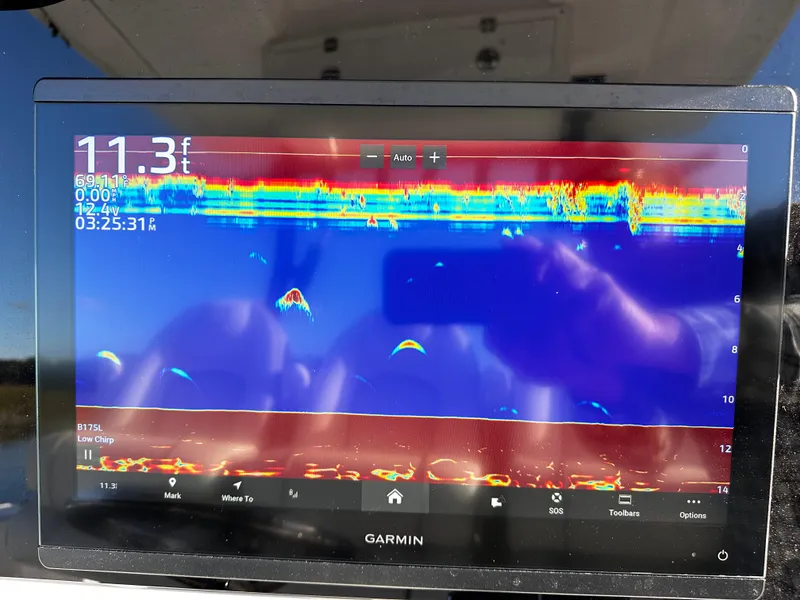 Slide: The Image of Garmin fishfinder display on 2025 Sea Fox 328 Commander boat, showing underwater sonar data. - 11