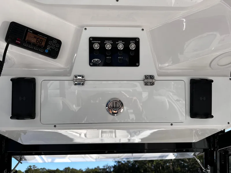 Slide: The Image of 2025 Sea Fox 328 Commander control panel with radio and switches. - 19