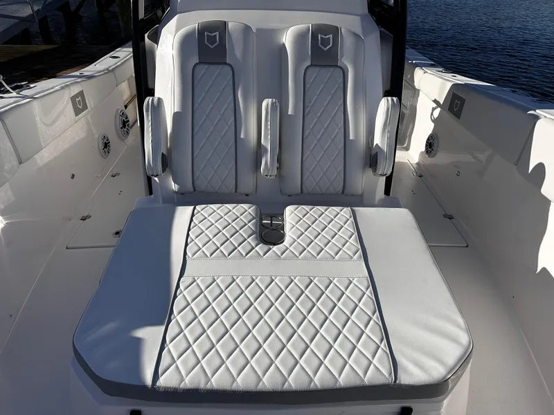 Slide: The Image of Luxurious seating on 2025 Sea Fox 328 Commander boat with quilted upholstery. - 23