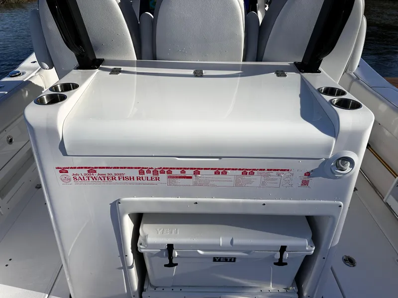Slide: The Image of 2025 Sea Fox 328 Commander boat with saltwater fish ruler and Yeti cooler. - 28