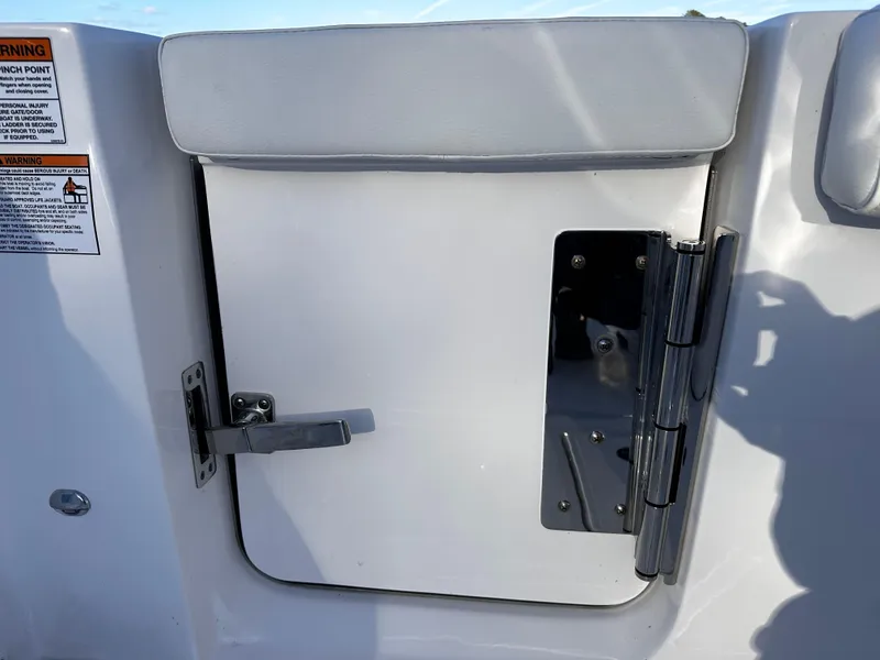 Slide: The Image of Sea Fox 328 Commander 2025 boat hatch with latch and hinge detail. - 31