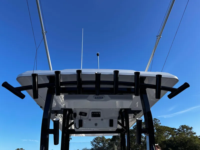 Slide: The Image of 2025 Sea Fox 328 Commander boat, view of the T-top and fishing rod holders. - 32