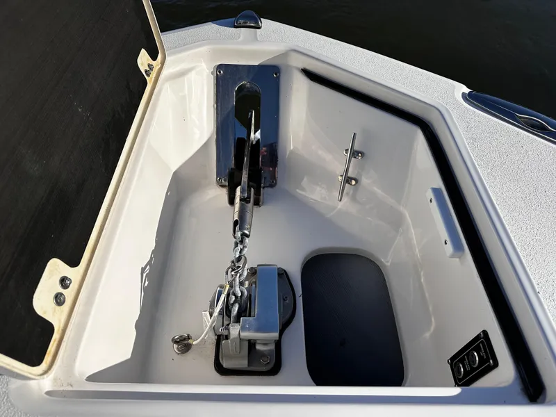 Slide: The Image of Anchor compartment of 2025 Sea Fox 328 Commander boat, featuring secure chain and cleat. - 36