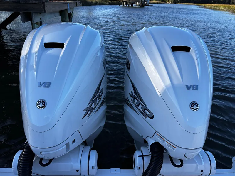 Slide: The Image of Twin Yamaha V8 outboard engines on a 2025 Sea Fox 328 Commander boat. - 4