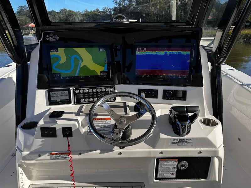 Slide: The Image of 2025 Sea Fox 328 Commander dashboard with navigation screens and controls. - 9