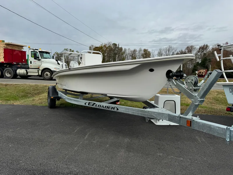 The Image of 2025 Delta Boatworks Delta 18 on EZ Loader trailer, parked outdoors. - 1