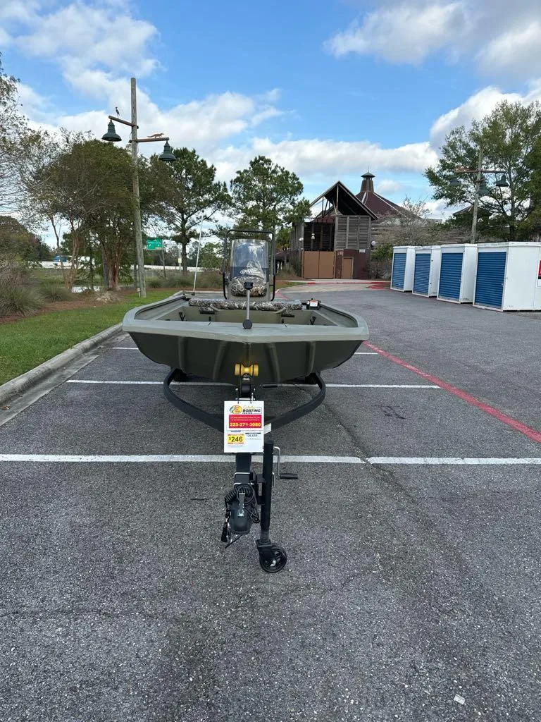 Slide: The Image of 2025 Tracker Grizzly 1860 CC boat in parking lot, front view. - 3