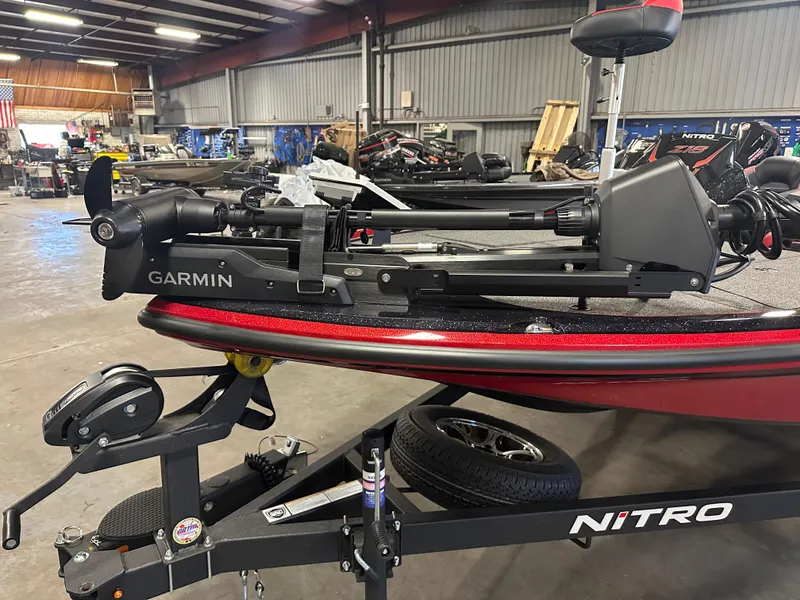 Slide: The Image of 2025 Nitro Z18 Pro boat with Garmin equipment in a workshop setting. - 14