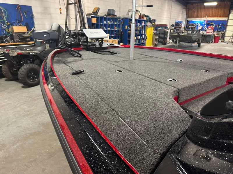 Slide: The Image of 2025 Nitro Z18 Pro boat in a workshop, featuring a spacious deck and modern equipment. - 15