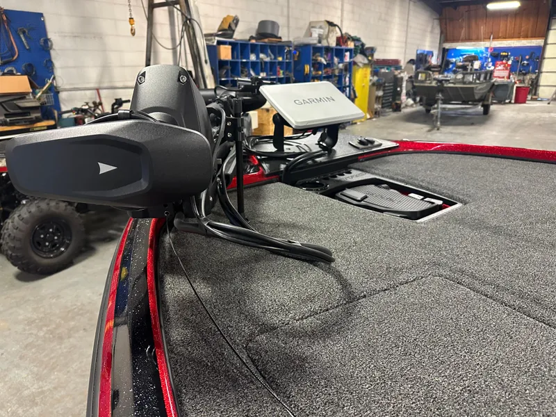 Slide: The Image of 2025 Nitro Z18 Pro boat with Garmin navigation system in a workshop setting. - 16