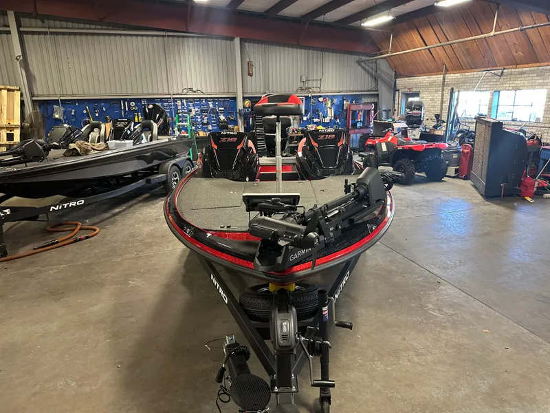 Slide: The Image of 2025 Nitro Z18 Pro boat in a workshop, featuring advanced equipment and sleek design. - 18