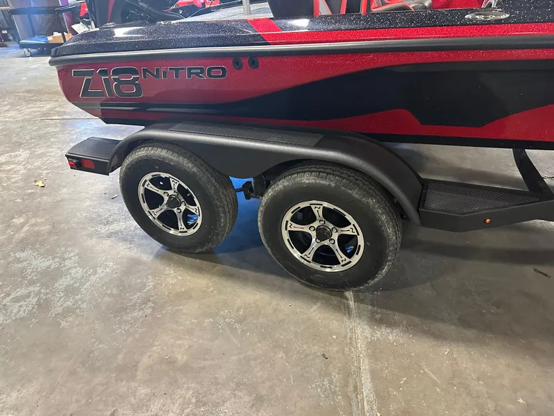 Slide: The Image of 2025 Nitro Z18 Pro boat trailer with dual wheels and sleek red design. - 22
