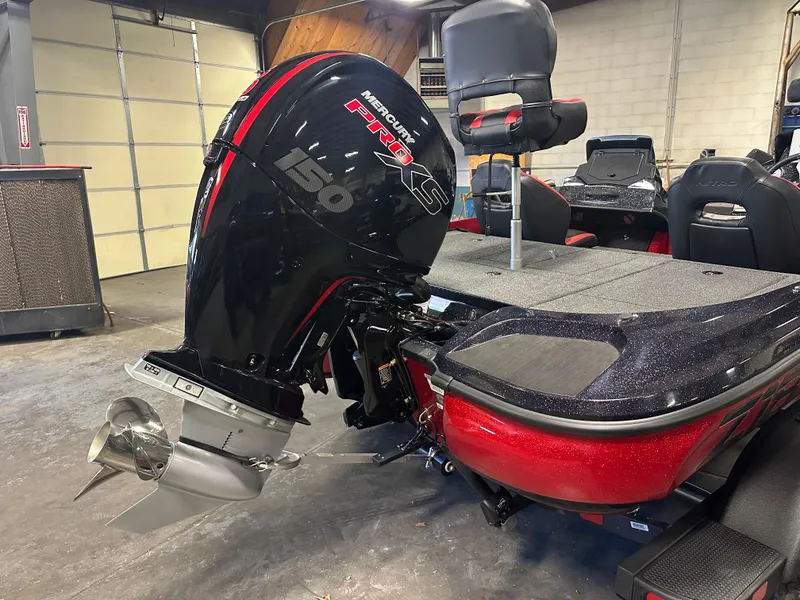 Slide: The Image of 2025 Nitro Z18 Pro boat with powerful outboard motor in a garage setting. - 4