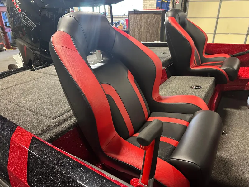Slide: The Image of 2025 Nitro Z18 Pro boat seats, red and black design, in a showroom setting. - 8