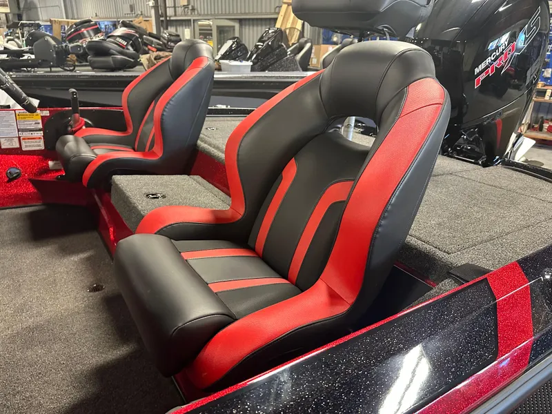 Slide: The Image of 2025 Nitro Z18 Pro boat seats, black and red design, in a showroom setting. - 9