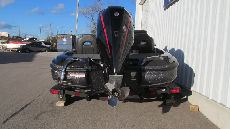 Slide: The Image of 2025 Nitro Z18 Pro boat with powerful outboard motor, parked on a sunny day. - 4
