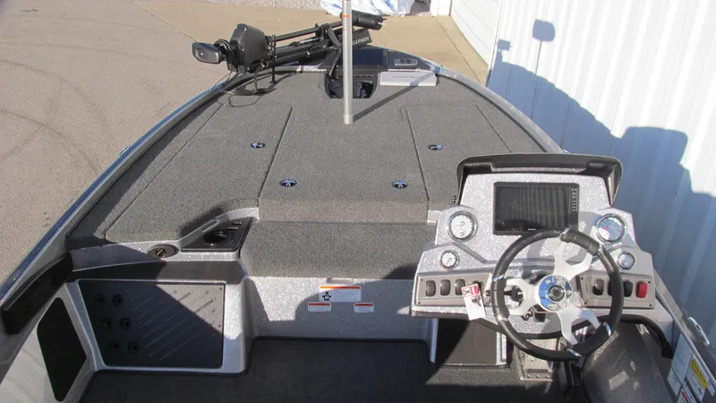 Slide: The Image of 2025 Nitro Z18 Pro boat dashboard with steering wheel and control panel. - 7