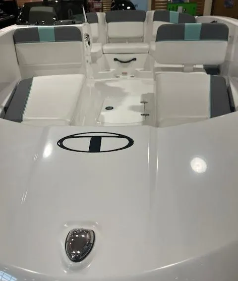 Slide: The Image of 2025 Tahoe T16 boat interior with white and gray seating, sleek design. - 3