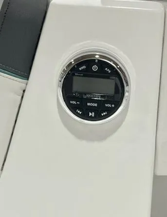 Slide: The Image of Tahoe T16 2025 boat audio control panel with volume and mode buttons. - 4