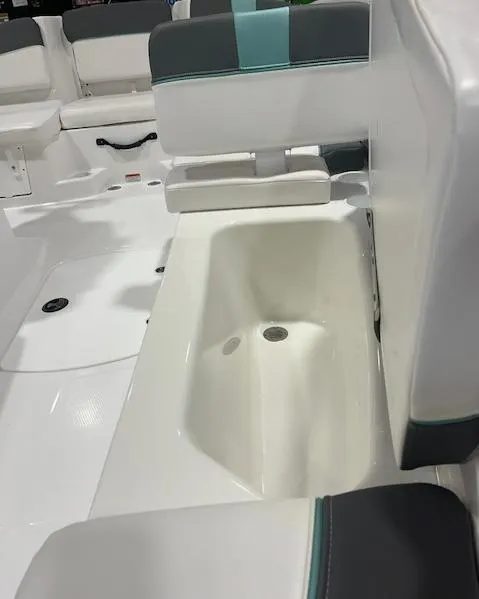 Slide: The Image of 2025 Tahoe T16 boat interior with white seating and storage compartment. - 6