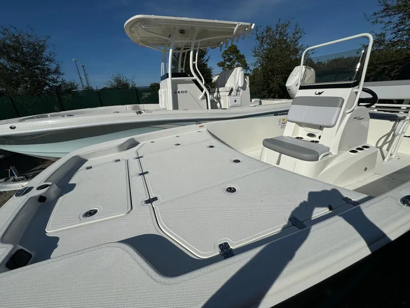 Slide: The Image of 2025 Mako Pro Skiff 19 CC boat with spacious deck and seating. - 3