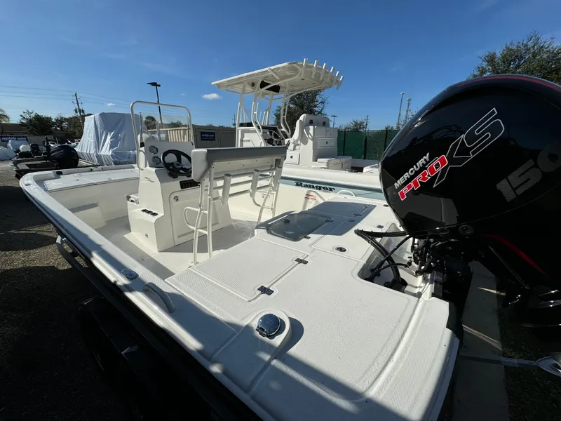 Slide: The Image of 2025 Mako Pro Skiff 19 CC boat with Mercury engine, spacious deck, and center console. - 4