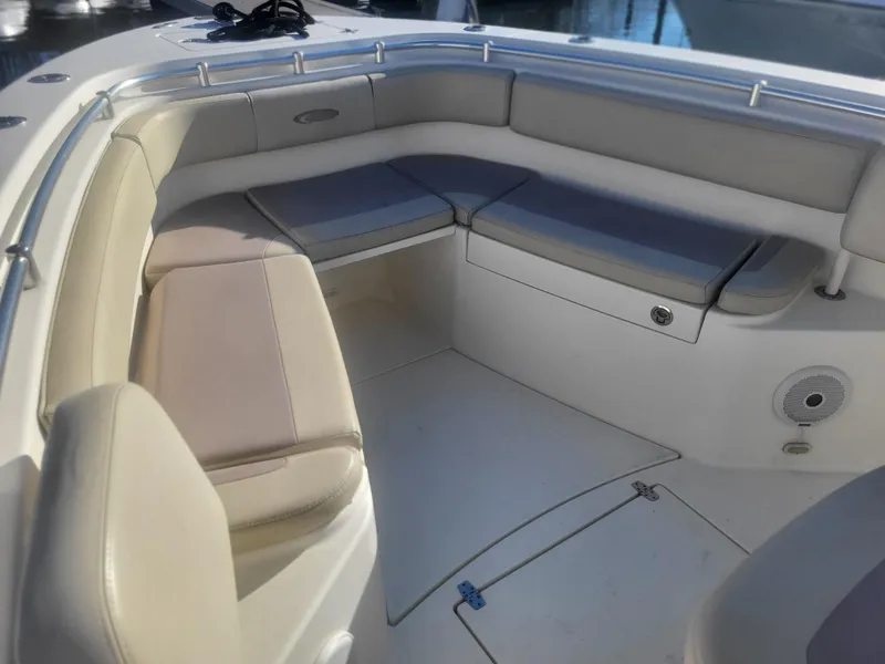 Slide: The Image of 2016 Cobia 277 Center Console boat with spacious seating area. - 10