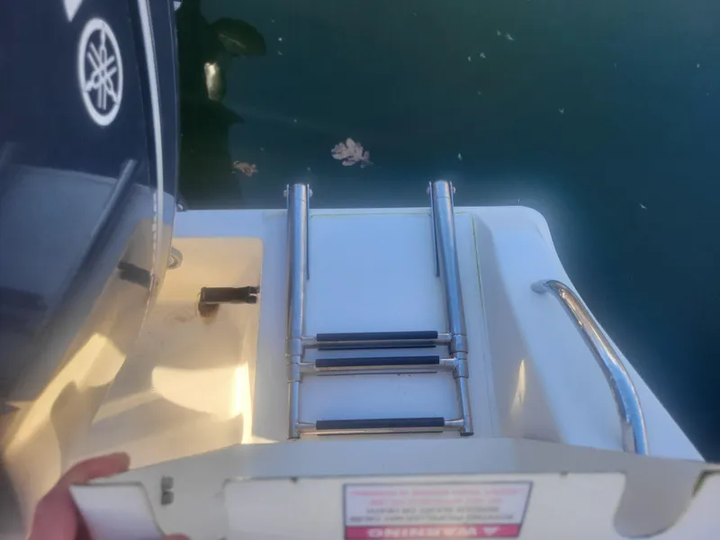 Slide: The Image of Cobia 277 Center Console 2016 boat with folded swim ladder. - 30