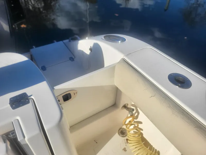 Slide: The Image of 2016 Cobia 277 Center Console boat interior with water reflection. - 32