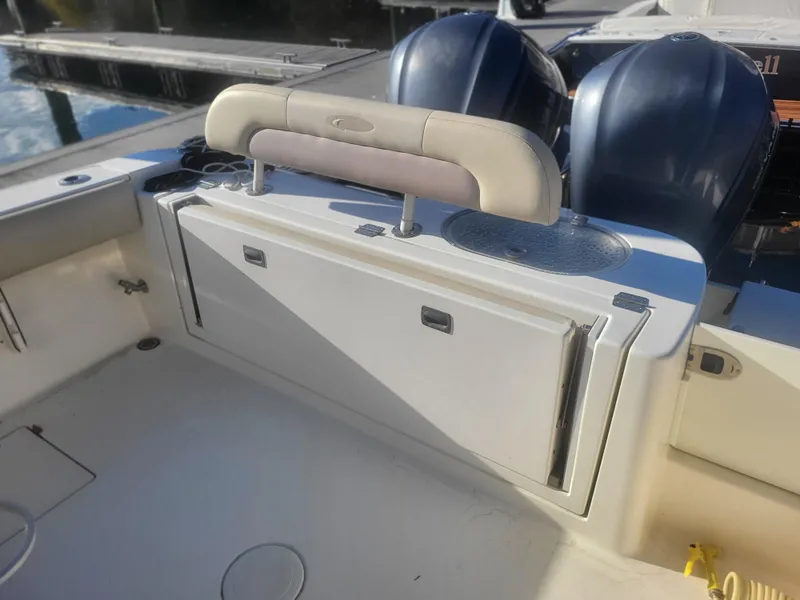 Slide: The Image of 2016 Cobia 277 Center Console boat interior with dual engines. - 34