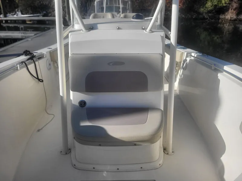 Slide: The Image of 2016 Cobia 277 Center Console boat interior with seating and console. - 36