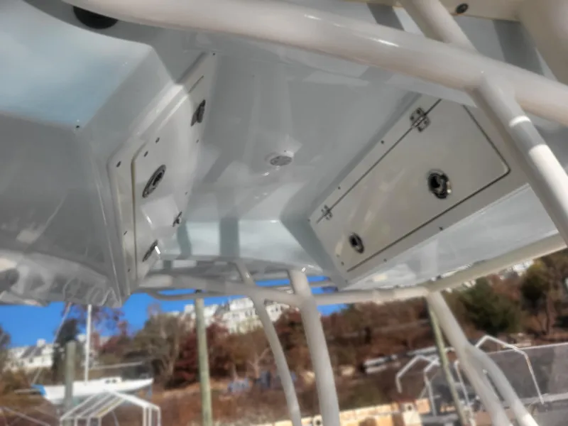 Slide: The Image of 2016 Cobia 277 Center Console boat interior with storage compartments. - 37