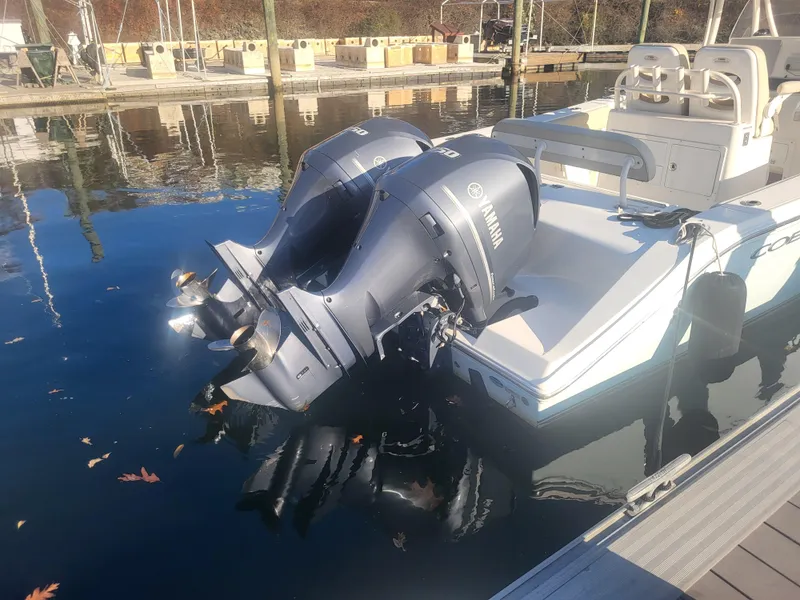 Slide: The Image of 2016 Cobia 277 Center Console boat with twin Yamaha outboard engines docked. - 4