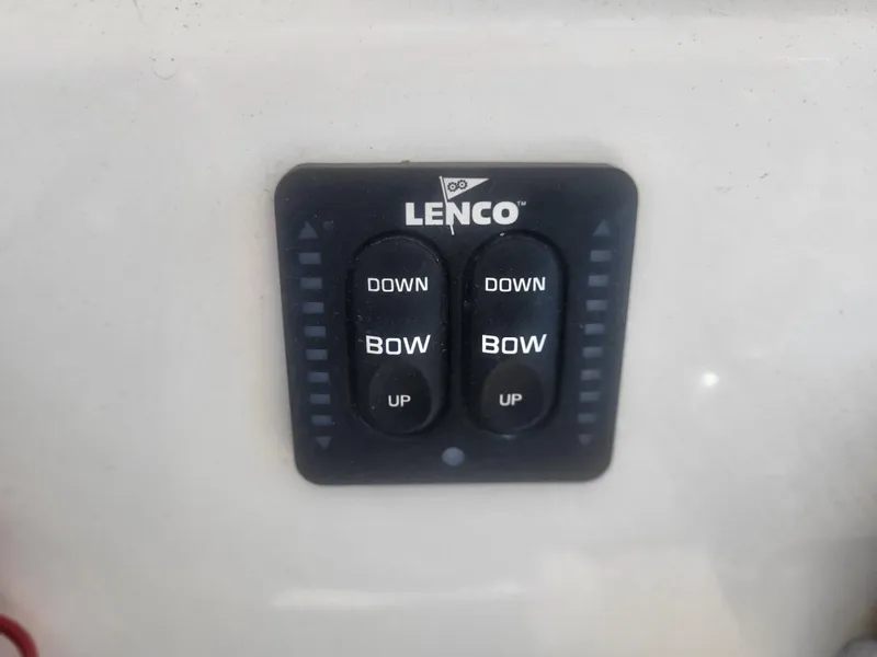 Slide: The Image of Lenco trim tab control panel on 2016 Cobia 277 Center Console boat. - 45