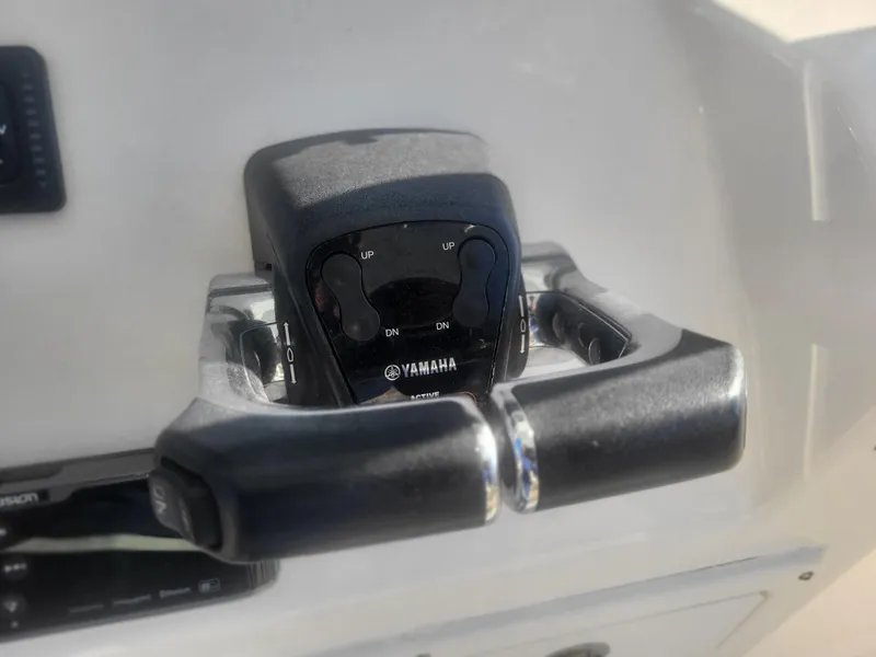 Slide: The Image of Yamaha throttle control on 2016 Cobia 277 Center Console boat dashboard. - 46