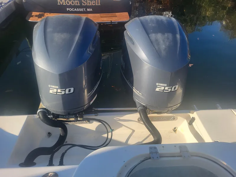 Slide: The Image of Twin Yamaha 250 engines on a 2016 Cobia 277 Center Console boat. - 5