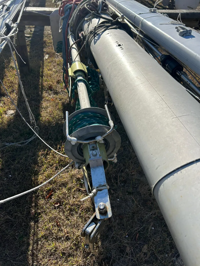 Slide: The Image of Mast and rigging of a 1986 Wauquiez Centurion 47 sailboat lying on grass. - 14