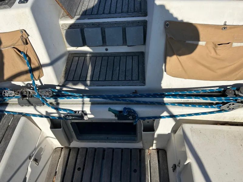 Slide: The Image of Cockpit of 1986 Wauquiez Centurion 47 sailboat with ropes and wooden flooring. - 16