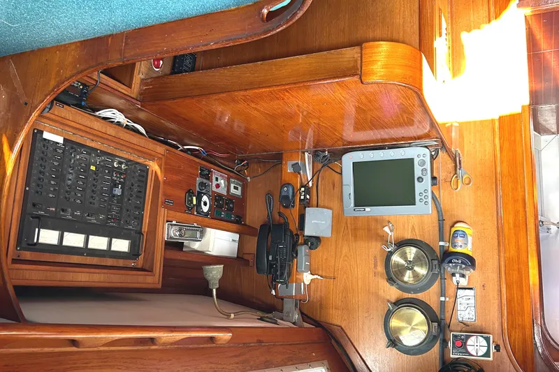Slide: The Image of Navigation station of 1986 Wauquiez Centurion 47 yacht with control panels and instruments. - 17
