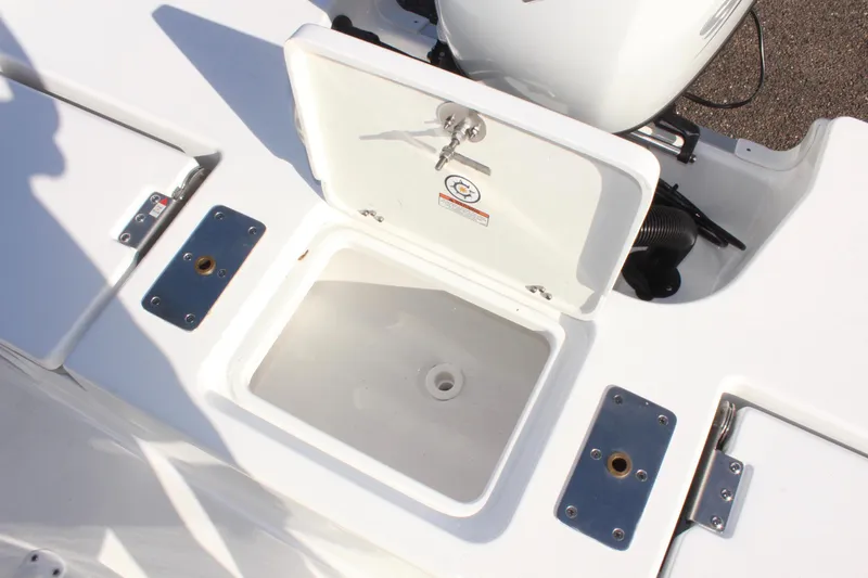 Slide: The Image of 2025 NauticStar 191 Hybrid boat storage compartment with open lid. - 11