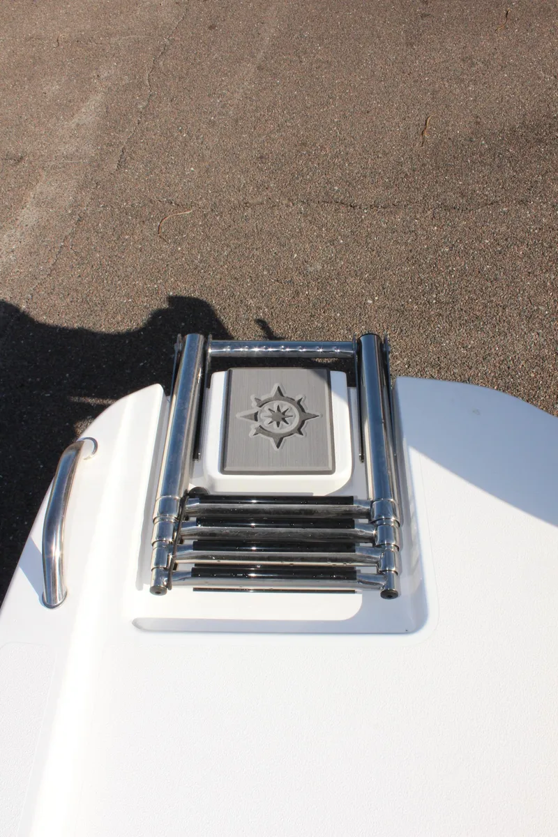 Slide: The Image of 2025 NauticStar 191 Hybrid boat ladder on deck, chrome finish. - 13