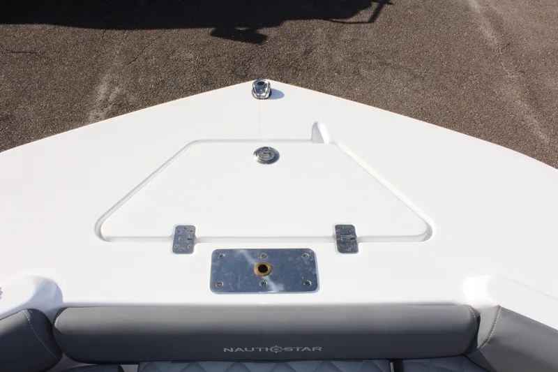 Slide: The Image of 2025 NauticStar 191 Hybrid boat deck with storage hatch and seating. - 20
