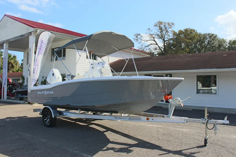 Slide: The Image of 2025 NauticStar 191 Hybrid boat on trailer at dealership. - 4