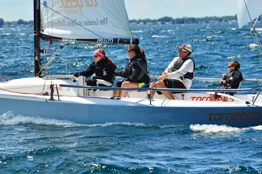 Slide: The Image of Sailing team on a 2026 J Boats J/70 navigating choppy waters. - 4
