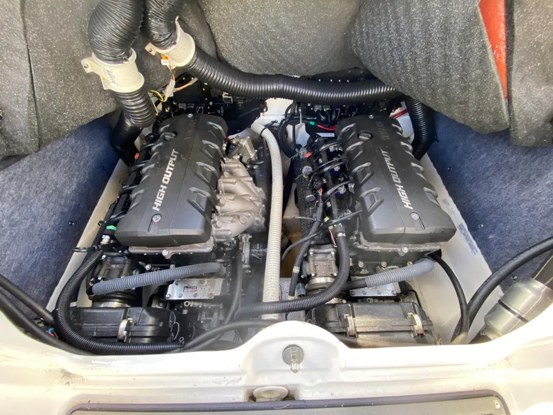 Slide: The Image of 2018 Yamaha Boats 242 Limited S engine compartment with dual high output engines. - 14