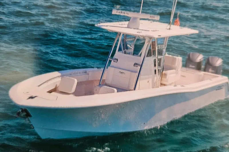 Slide: The Image of 2017 Invincible 33 Open Fisherman boat on the ocean. - 11